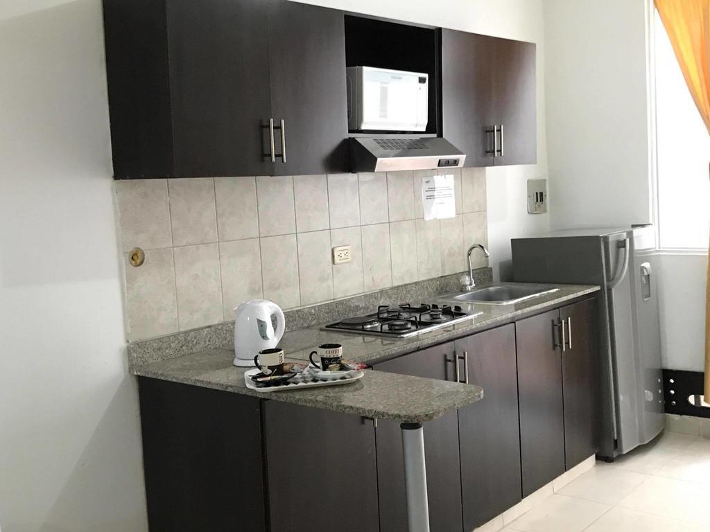 Arco Apartasuites Cali Bagian luar foto