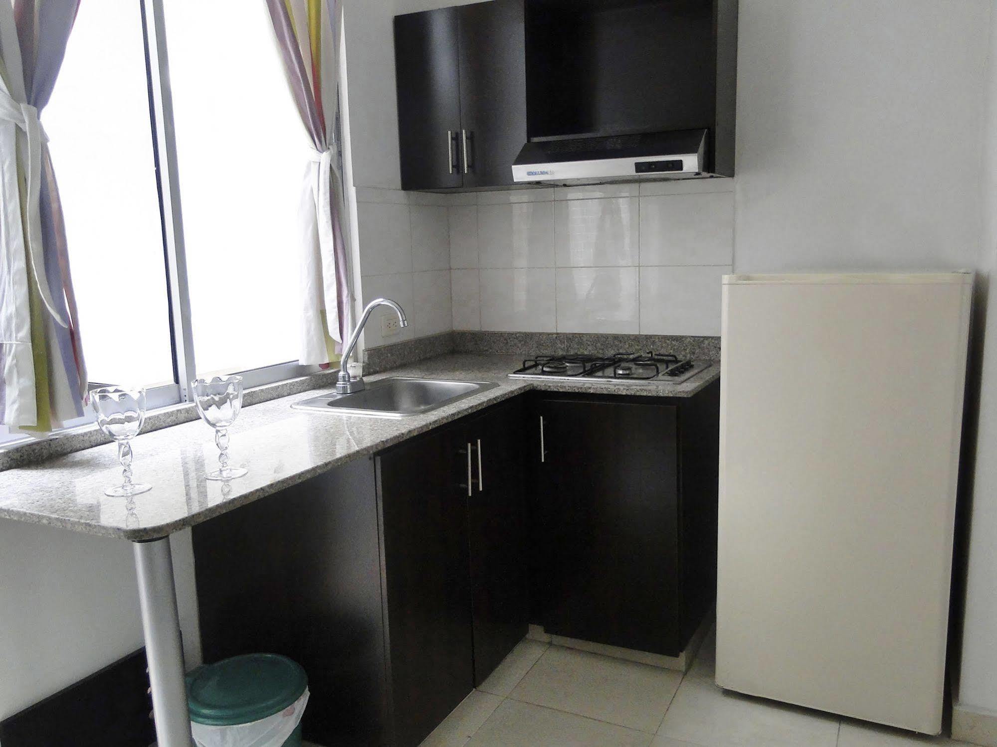 Arco Apartasuites Cali Bagian luar foto